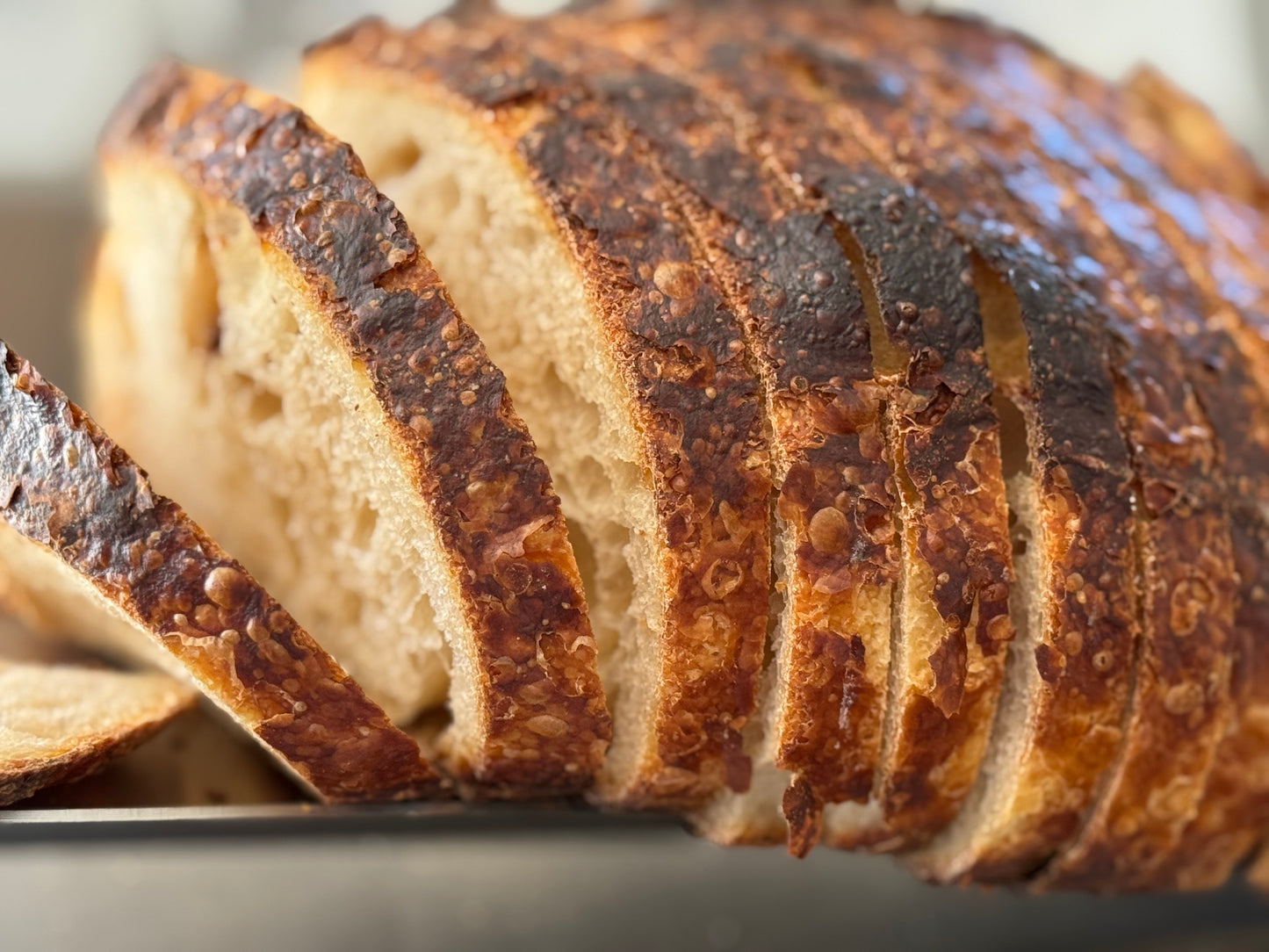 Both sliced and unsliced available. Please add this item to your cart if you would like your bread sliced.